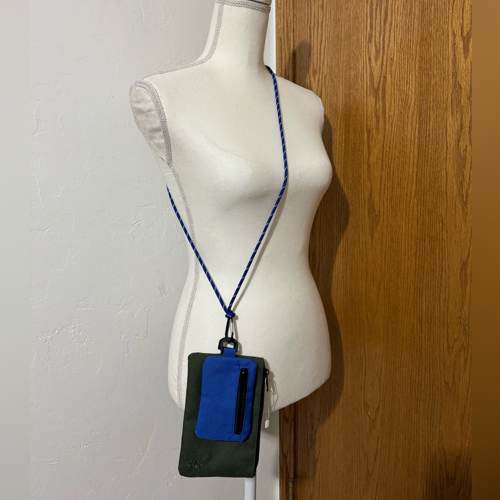 Free People olive & blue zipper pouches on a crossbody strap